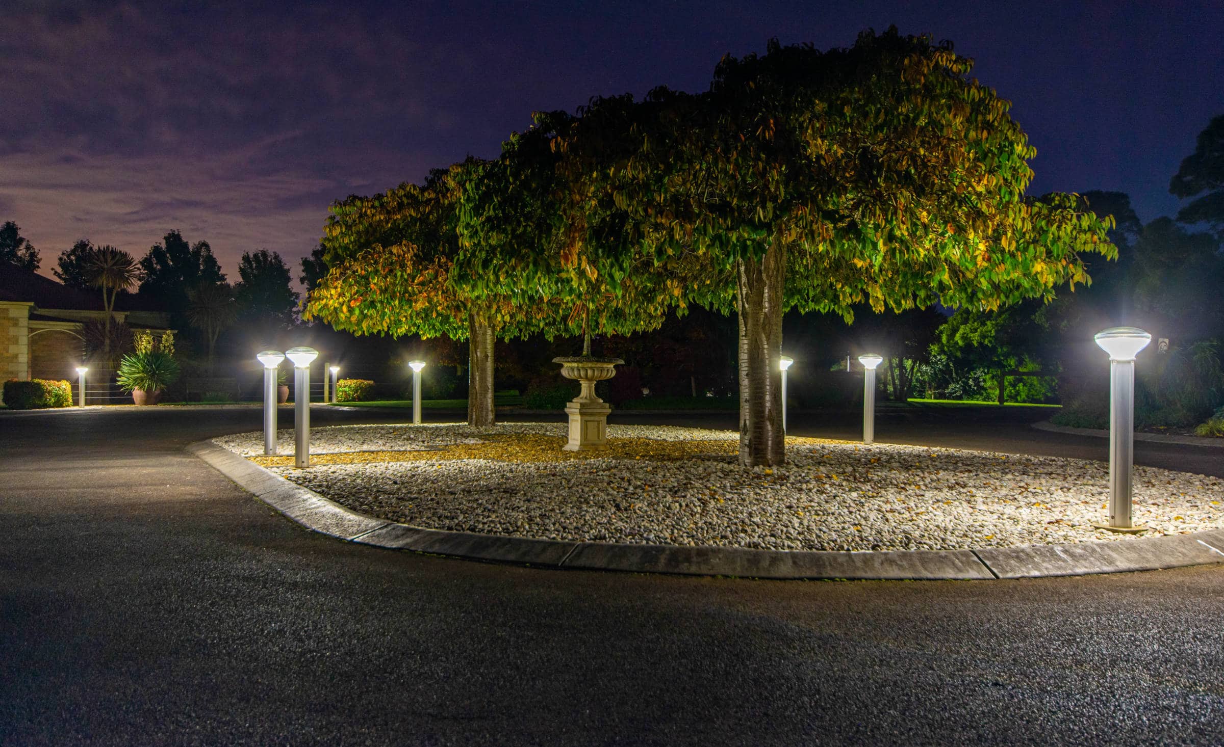 Solar bollards lighting a private driveway and turn-around at night